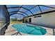 Inviting screened-in pool with clear blue water and ample patio space for relaxation and entertainment at 2416 Caraway Dr, Venice, FL 34292