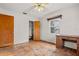 Bedroom with hardwood floors and desk, featuring a closet and natural light from a window at 2435 37Th N Ave, St Petersburg, FL 33713