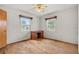 Bedroom with hardwood floors and desk, featuring natural light from two windows at 2435 37Th N Ave, St Petersburg, FL 33713