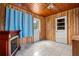 Cozy bonus room with wood paneling, tiled floors, a decorative fireplace and bright natural light at 2435 37Th N Ave, St Petersburg, FL 33713