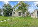 Charming single-story home with a well-maintained lawn and mature trees providing ample shade at 2435 37Th N Ave, St Petersburg, FL 33713