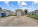 Exterior view of detached garage with a long driveway at 2435 37Th N Ave, St Petersburg, FL 33713