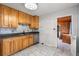 Functional kitchen with wooden cabinets, stainless steel appliances, and tiled flooring at 2435 37Th N Ave, St Petersburg, FL 33713