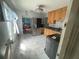 Traditional kitchen featuring tile flooring, wood cabinets and stainless steel appliances at 2435 37Th N Ave, St Petersburg, FL 33713
