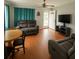 Cozy living room with hardwood floors, a ceiling fan, and comfortable seating arrangements at 2435 37Th N Ave, St Petersburg, FL 33713