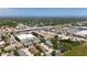 An aerial view displays the neighborhood with the adjacent busy highway at 2530 Sandy Beach Ln, Clearwater, FL 33763
