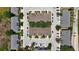 An aerial view of an apartment complex showing a bird's eye view of the layout at 2530 Sandy Beach Ln, Clearwater, FL 33763