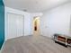 Bright bedroom features a closet, neutral walls and carpet at 2530 Sandy Beach Ln, Clearwater, FL 33763