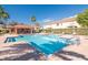 Community pool featuring a covered seating area, lounge chairs, and refreshing clear water for residents to enjoy at 2530 Sandy Beach Ln, Clearwater, FL 33763