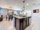 Bright kitchen featuring granite countertops, stainless steel appliances, and tile flooring at 2530 Sandy Beach Ln, Clearwater, FL 33763