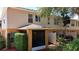 The home features a screened lanai and lush, low maintenance landscaping at 2530 Sandy Beach Ln, Clearwater, FL 33763
