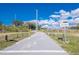 Well-maintained community trail with clear signage, promoting outdoor activity and connectivity in the Pinellas community at 2530 Sandy Beach Ln, Clearwater, FL 33763