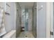 Bathroom shower featuring modern tile, glass door, and sleek hardware at 2810 Doone Cir, Palm Harbor, FL 34684