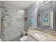 Updated bathroom with a marble shower and vanity at 2810 Doone Cir, Palm Harbor, FL 34684