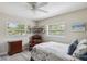 Cozy bedroom featuring natural light and a comfortable seating area at 2810 Doone Cir, Palm Harbor, FL 34684
