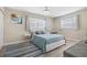 Well-lit bedroom with a plush bed and decorative accents at 2810 Doone Cir, Palm Harbor, FL 34684