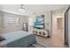 Bedroom featuring stylish decor, a television, and an en-suite bathroom at 2810 Doone Cir, Palm Harbor, FL 34684