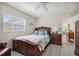 Comfortable bedroom with natural light and views of the surrounding landscape at 2810 Doone Cir, Palm Harbor, FL 34684