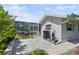 The home's exterior shows a paved patio outside of a screened in lanai with access to the house at 2810 Doone Cir, Palm Harbor, FL 34684