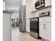 Modern kitchen featuring stainless steel appliances and white cabinetry at 2810 Doone Cir, Palm Harbor, FL 34684