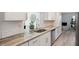 Open kitchen design with granite countertops and stainless steel appliances at 2810 Doone Cir, Palm Harbor, FL 34684