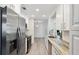 Bright, modern kitchen with stainless steel appliances and ample counter space at 2810 Doone Cir, Palm Harbor, FL 34684