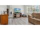 Inviting living room featuring a large window and comfortable seating at 2810 Doone Cir, Palm Harbor, FL 34684
