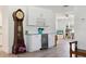 Open-concept space connecting the living area with custom cabinets and a wine fridge at 2810 Doone Cir, Palm Harbor, FL 34684