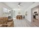 Open-concept living room with dining area and view into the kitchen at 2810 Doone Cir, Palm Harbor, FL 34684