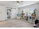 Living room featuring a barn door, large window, and bookshelves at 2810 Doone Cir, Palm Harbor, FL 34684