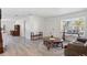 Spacious living room showcasing the home's neutral color palette and wood flooring at 2810 Doone Cir, Palm Harbor, FL 34684