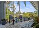 Cozy covered patio featuring comfortable seating and views of the landscaped yard at 2810 Doone Cir, Palm Harbor, FL 34684
