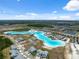 Aerial view of the Epperson Lagoon and community, highlighting the unique water feature, surrounding homes, and landscaping at 31970 Blue Passing Loop, Wesley Chapel, FL 33545