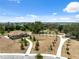 A single-story community center building in a landscaped park setting with walking paths and a playground at 31970 Blue Passing Loop, Wesley Chapel, FL 33545
