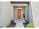 Inviting front entrance with a decorative door and 'welcome' mat at 31970 Blue Passing Loop, Wesley Chapel, FL 33545