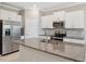 Stylish kitchen with granite countertops and stainless steel appliances at 31970 Blue Passing Loop, Wesley Chapel, FL 33545