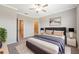 Spacious main bedroom with a ceiling fan, ensuite bathroom and walk-in closet at 31970 Blue Passing Loop, Wesley Chapel, FL 33545
