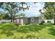 Lush backyard featuring well-manicured lawn, providing ample space for outdoor activities and enjoyment at 3302 W Beaumont St, Tampa, FL 33611