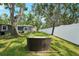 Lush backyard with well-maintained lawn and outdoor seating, perfect for relaxation and enjoying the beautiful scenery at 3302 W Beaumont St, Tampa, FL 33611