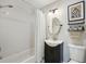 Modern bathroom featuring a shower and tub combination, elegant vanity, and stylish fixtures at 3302 W Beaumont St, Tampa, FL 33611