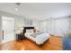 Bright bedroom with hardwood floors, cozy bed, and ample closet space at 3302 W Beaumont St, Tampa, FL 33611