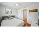 Inviting bedroom featuring a comfortable bed, modern TV, and ample natural light at 3302 W Beaumont St, Tampa, FL 33611