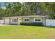 Inviting single-story house with a manicured lawn and bright yellow front door at 3302 W Beaumont St, Tampa, FL 33611