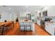 Modern kitchen with white cabinets, stainless steel appliances, and a center island with seating at 3302 W Beaumont St, Tampa, FL 33611