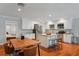Kitchen and dining area featuring white cabinets, stainless steel appliances, and center island with seating at 3302 W Beaumont St, Tampa, FL 33611