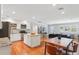 Open layout featuring kitchen, dining, and living areas, with modern decor and hardwood floors at 3302 W Beaumont St, Tampa, FL 33611