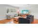 Comfortable living room with hardwood floors, shutters, modern furniture, and stylish decor at 3302 W Beaumont St, Tampa, FL 33611