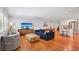 Open-concept living space featuring hardwood floors and a seamless flow to the kitchen at 3302 W Beaumont St, Tampa, FL 33611