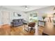 Stylish home office with hardwood floors, a comfortable sofa, and a large window for natural light at 3302 W Beaumont St, Tampa, FL 33611