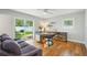 Bright home office features hardwood floors, large windows, and a stylish writing desk at 3302 W Beaumont St, Tampa, FL 33611